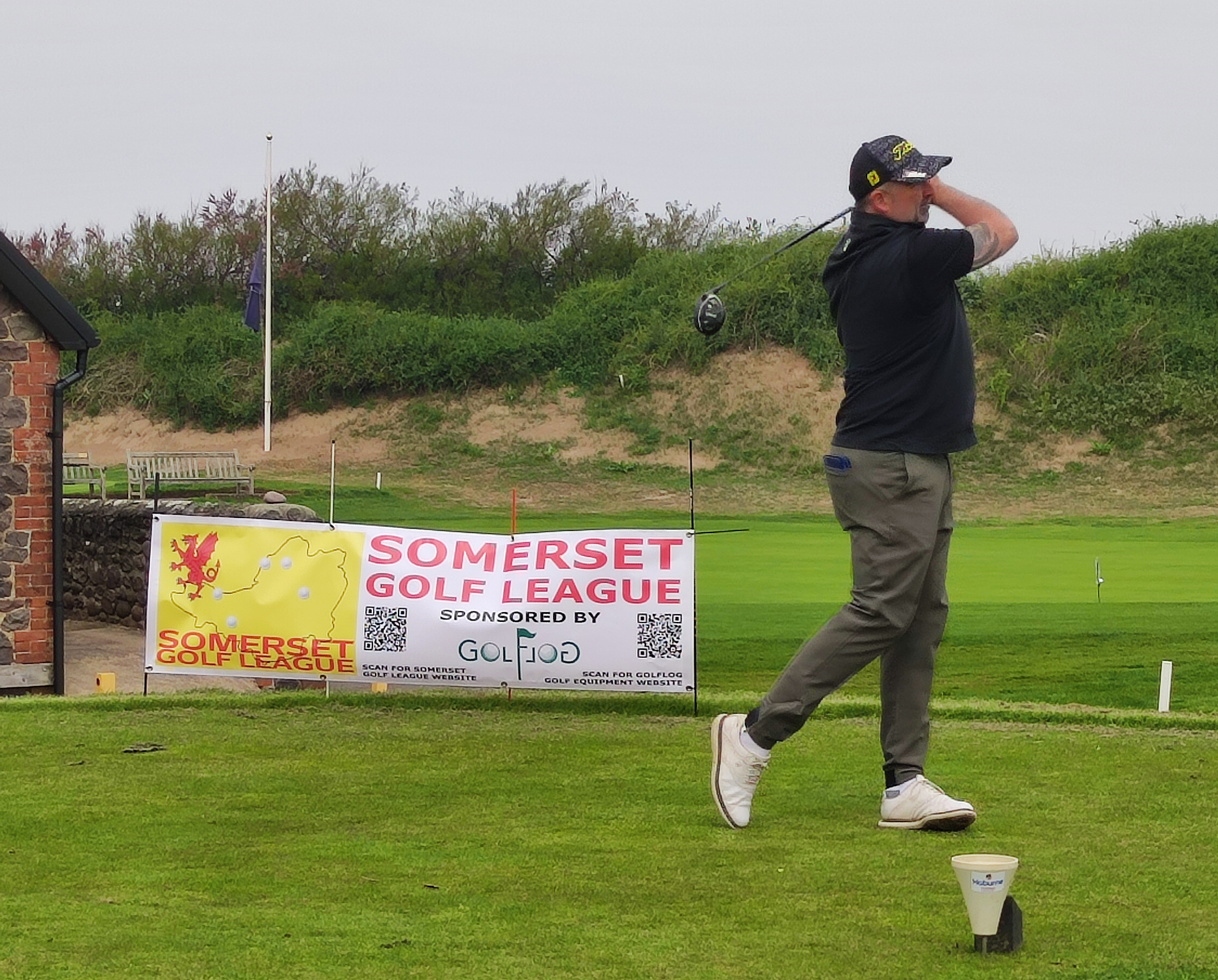 Jason Brook hits the first tee shot as Oake Manor visit Minehead and West Somerset